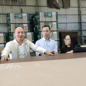 Tour guide shows clients around Mingyuan Wood factory